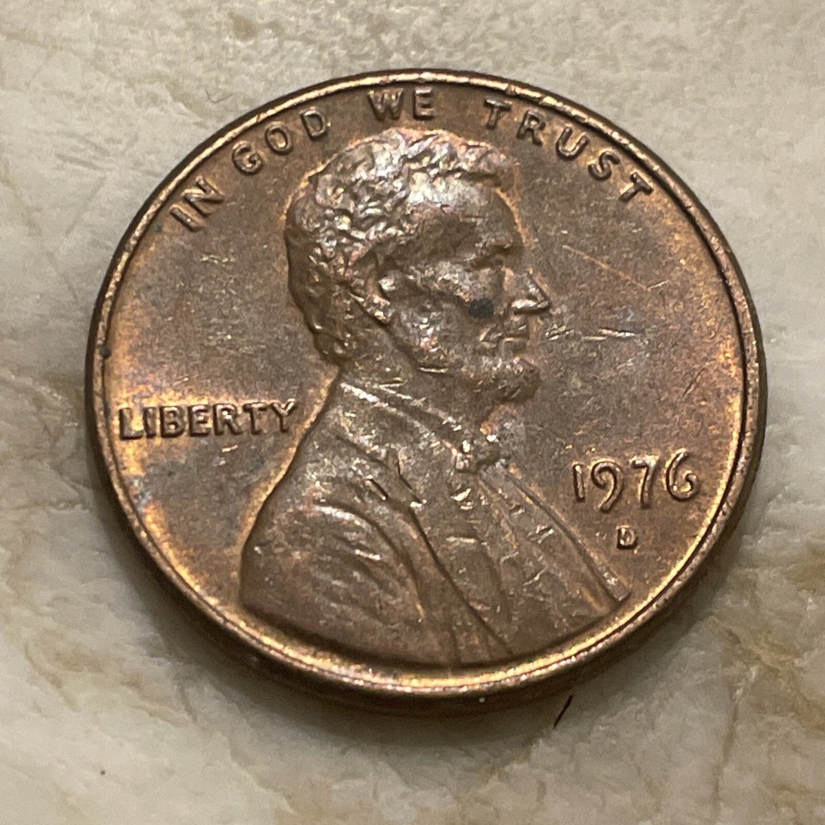 1976 penny doubled die comparison: machine doubling (left) vs genuine DDO variety (right) showing letter separation on LIBERTY